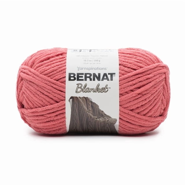 Bernat® Blanket™ #6 Super Bulky Polyester Yarn in terracotta rose, 10.5oz/300g skein with 220 yards, showing a chenille-style thick yarn ball wrapped in a white label with the Bernat logo and a knitted blanket image, ideal for knitting cozy home décor and soft afghans.