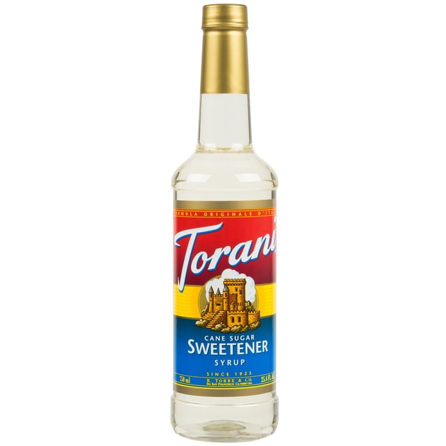 Torani 750 mL Cane Sugar Sweetener Syrup in a clear plastic bottle with a gold cap, featuring a vibrant label with red, yellow, and blue accents and an illustration of a castle. Made with pure cane sugar and natural flavors, this table syrup is ideal for coffee shops and cafes, suitable for hot and cold beverages. Compatible with a .25 oz. syrup pump (sold separately).