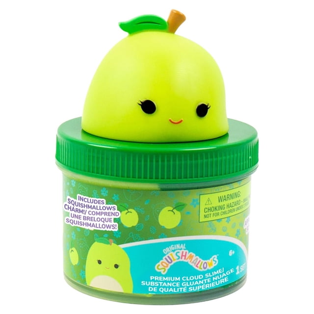 Original Squishmallows™ Ashley the Apple Premium Cloud Slime in an 8 oz. clear container with a green lid topped by a smiling apple-shaped charm, featuring two-toned green apple-scented slime and holographic purple glitter for sensory play.