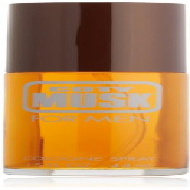 COTY MUSK 1.5 Cologne Spray for Men, presented in a cylindrical bottle with a brown cap and amber-colored liquid. The label features bold white text displaying the product name. Ideal fragrance for men, suitable for daily wear or special occasions.