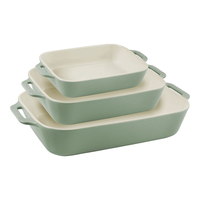 STAUB Ceramique Rectangular Baking Dish Set Eucalyptus 3 Piece with three nesting dishes in eucalyptus green and ivory finish. Sizes include 7.5 x 6 inches, 10.5 x 7.5 inches, and 13 x 9 inches. Made of durable stoneware with a vitreous porcelain-enamel finish for even heat retention and scratch resistance. Ideal for baking, roasting, and serving. Suitable for oven, microwave, freezer, and dishwasher use, making it a versatile addition to kitchen bakeware.