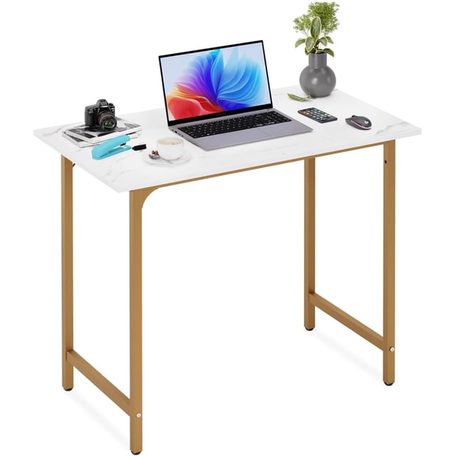 BestOffice Computer Desk, Home, Modern Simple Style for Home Office Study Writing, Gold. A modern desk with a white tabletop featuring a marble-like finish and a durable gold metal frame. The desk is shown with a laptop, camera, stapler, coffee cup, mouse, smartphone, and a small plant, emphasizing its adjustable configuration, spacious work surface, and sturdy construction.