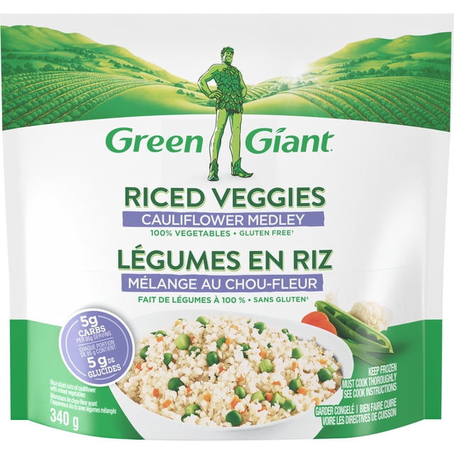 Green Giant Riced Veggies Cauliflower Medley frozen vegetable package showing a bowl of riced cauliflower mixed with peas and carrots, the Green Giant logo above a green farm landscape, labeled gluten free, 100% vegetables, 5g carbs per serving, and 340g net weight, ideal for quick vegetable additions to meals.
