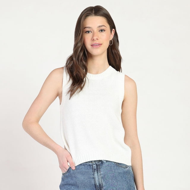 Bloom Girl Lace Back Sweater sleeveless top in white with a crew neckline and relaxed fit, featuring knit texture and an open back with crisscross lace-up ties, paired with blue denim jeans in a studio setting.