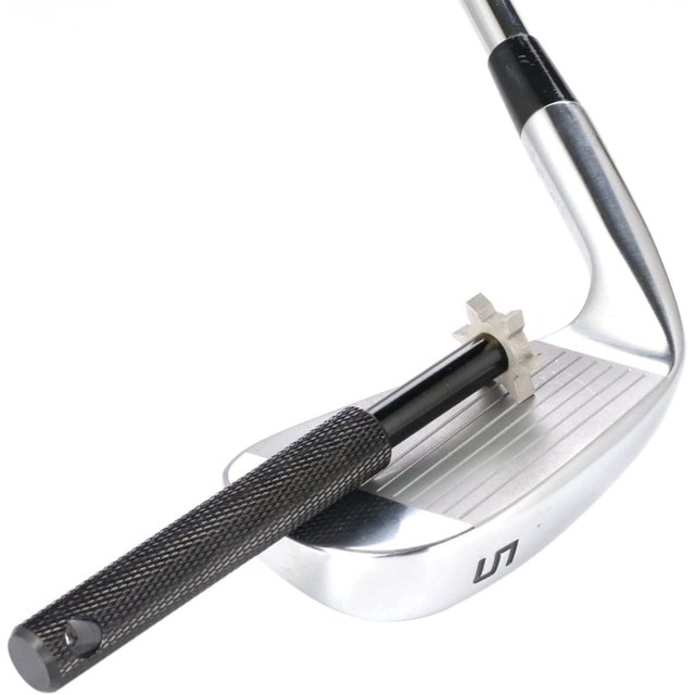 Golf Club Groove Sharpener Tool by Biinggo shown in use on a silver golf club. This lightweight tool features a durable alloy construction, a black textured handle, and a 6-blade metal groove sharpener for cleaning and sharpening grooves on golf clubs, including drivers, woods, and cues. Suitable for maintaining club performance and restoring older clubs in various weather conditions. A practical golf cleaning tool for enthusiasts.
