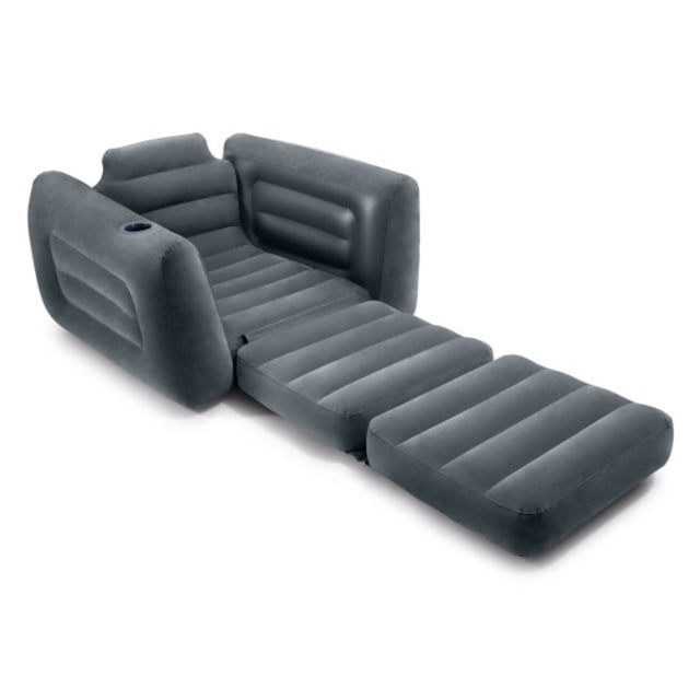 Intex Pull-Out Chair in charcoal gray velvety finish, shown fully extended as a twin air mattress with horizontal air chambers and a built-in cup holder. Designed for living room seating and accent use, it inflates quickly with a 2-in-1 valve and folds compactly for easy storage or travel.