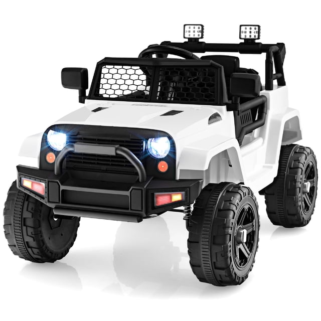 Patiojoy 12V Kids Ride On Car Electric Vehicle Jeep in white, featuring a rugged design with bright LED headlights, a black grille, and large textured wheels. This powered ride-on toy includes a spacious seat with a safety belt, a steering wheel with music and horn buttons, and a parental remote control for added safety. Suitable for children aged 3-7 years, it offers speeds of 1.5-2.8 mph and includes features like a USB port, power display, and slow start function for a realistic and safe driving experience.