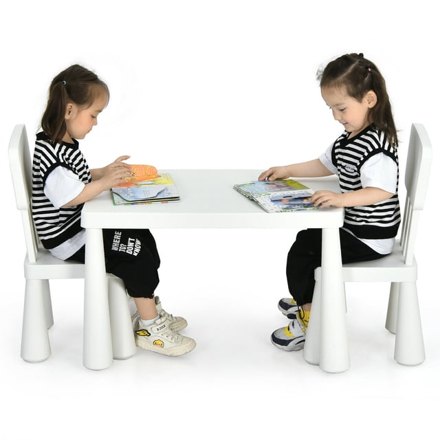 Gymax Kids Table & 2 Chairs Set in white, featuring a rectangular table measuring 30'' x 21'' x 19'' and two ergonomic chairs with backrests. Made of non-toxic PP material, this set is ideal for children aged 1 to 7 years for activities like drawing, studying, or dining. The smooth surface and rounded edges ensure safety, while the lightweight design allows easy movement. Shown in a bright, minimalistic setting with two children seated and reading books.