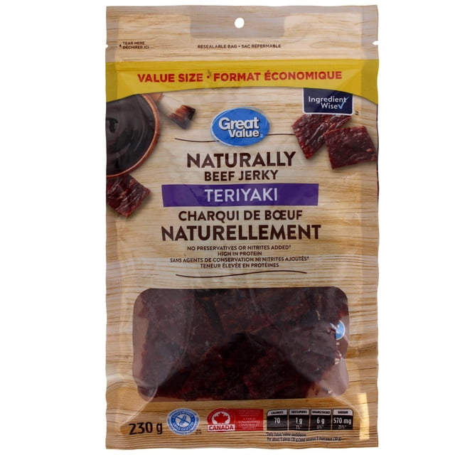 Great Value Naturally Teriyaki Beef Jerky in a 230 g resealable value size bag with wood grain background, featuring the brand logo, teriyaki flavor label, gluten-free and Canadian origin symbols, and nutrition facts including 70 calories and 570 mg sodium per serving, suitable for high-protein snacking.