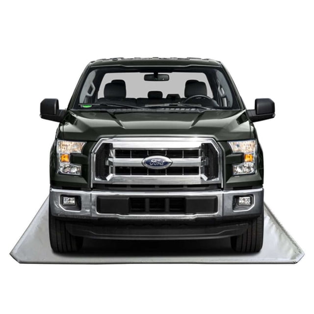 Floor Defender Garage Containment Mats - 8' x 21', shown in a concrete grey color, placed under a parked truck. This durable garage floor mat is designed to keep your garage clean by catching grease, oil, mud, dirt, water, and antifreeze. Made from 900 gsm vinyl material with etofoam technology, it is easy to use, clean, and store. Includes adhesive Velcro stickers for secure placement.