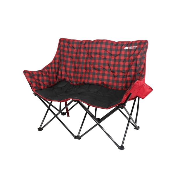 Ozark Trail Camping Love Seat Chair in red and black checkers pattern with padded seat, back, and side panels, supported by a durable black steel frame, featuring a fabric cup holder on the right armrest, folds for easy transport, ideal for adult outdoor camping seating.
