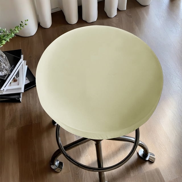 Czzoypi Round Bar Stool Seat CoversStretch Round Bar Stool Covers Washable Bar Stool Seat Covers in yellow, shown on a round bar stool with a chrome base. The cover is made of elastic milk silk polyester, offering a snug fit and soft texture. Ideal for protecting bar stool seats in kitchens, dining areas, or bars. The solid yellow color adds a vibrant touch to the decor. Dimensions: 30x30x6cm.