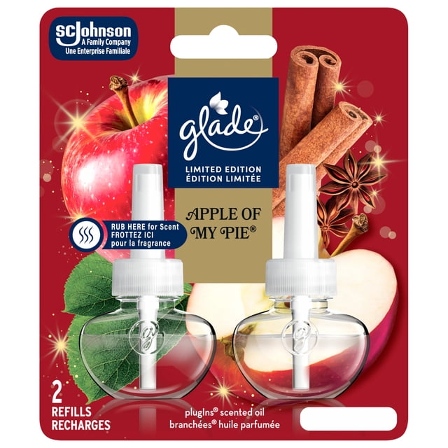 Glade Plugins® Air Freshener Oil Refill, Apple of my Pie™, Limited Edition featuring two clear apple-shaped refill bottles with white caps on a red background with images of red apples, apple slices, cinnamon sticks, star anise, and green leaves, highlighting the apple cinnamon scent and 2 refills per pack for use with Glade plug-in warmers.
