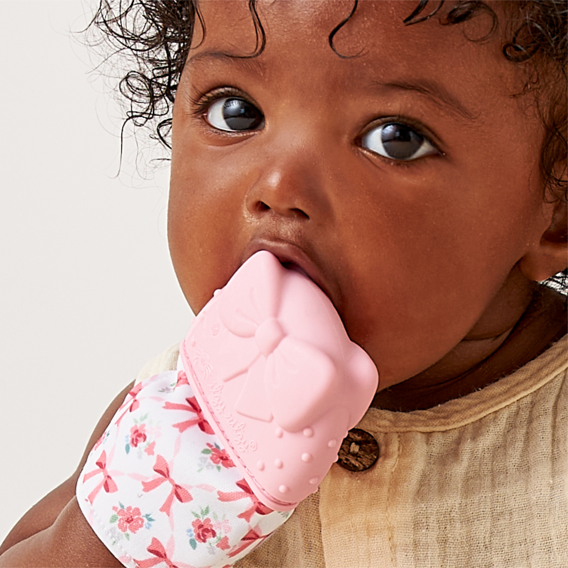 Itzy Ritzy Itzy Mitt™ Bow Silicone Teether for Infants, 0+ Months
