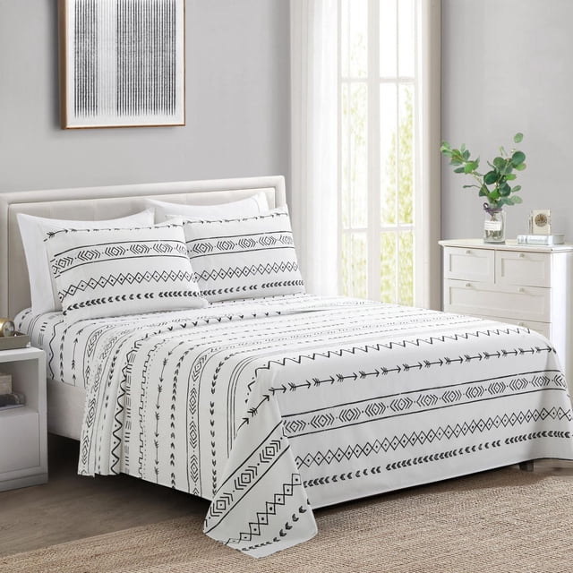 Marina Decoration Ultra Soft Silky Deep Pocket Rich Printed Bedding Rayon from Bamboo All Season Sheet Set with Pillowcases in white with black Native American Indian and arrow geometric patterns. Includes fitted sheet with 16-inch deep pockets, flat sheet, and printed plus plain pillowcases on a modern bed in a light grey room with framed art, white dresser, and natural light. Suitable for all-season comfort and breathable softness.