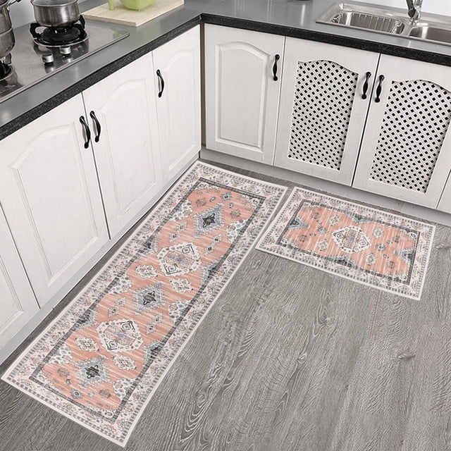 Dvkptbk Kitchen Floor Mats Two Piece Non Slip Kitchen Floor Mats Treadmill Rug Set Doormat Boho Doormat Rubber Rug Indoor Floor Mats Home Decoration. The set includes two mats, one measuring 15.7 x 23.6 inches and the other 15.7 x 47.2 inches, featuring a boho-inspired orange and blue pattern with intricate geometric designs. Made from nylon and spandex with a non-slip rubber backing, these mats are ideal for kitchens, entryways, or home offices. Shown in a modern kitchen setting with grey flooring and white cabinetry.