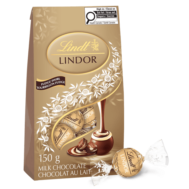 Lindt LINDOR Fudge Swirl Chocolate Truffles 150-gram bag featuring milk chocolate shell with a smooth melting dark and white chocolate center, individually wrapped in gold foil with Lindt branding, shown with pouring chocolate swirl and truffle pieces, suitable for sharing or gifting.