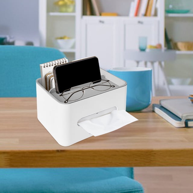 Nkmbld Tissue Box Holder Decorative Desktop Paper Drawer, a multifunctional storage box designed for living rooms, offices, and more. The white tissue box holder features a sleek, modern design with compartments for organizing remote controls, glasses, smartphones, and notebooks. It fits most standard-sized tissue boxes and is crafted from durable materials. Displayed on a wooden coffee table in a cozy living room setting with books and decor in the background.