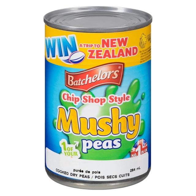 Batchelors Mushy Chip Shop Peas 300g can with blue and yellow label featuring green mushy peas illustration, British flag icon, and a promotion for a trip to New Zealand, ideal for pairing with traditional British fish and chips or as a side dish.