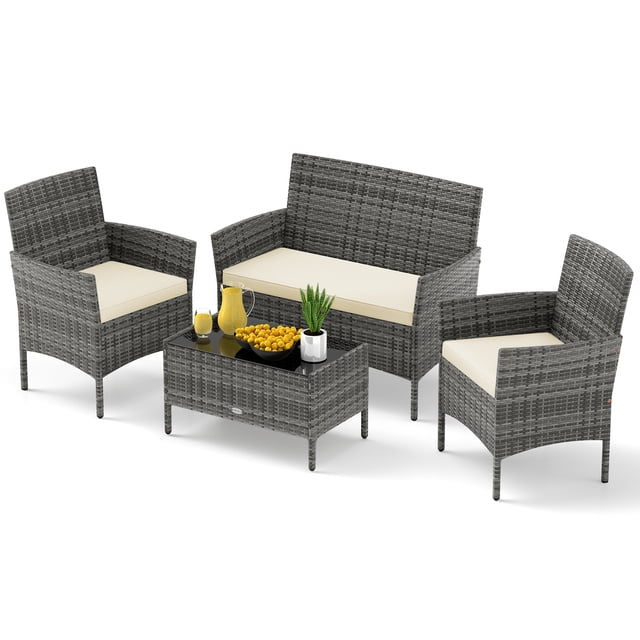 Gymax Set Of 4 Patio Furniture Set w/Washable Cushions & Tempered Glass Coffee Table Beige. Includes a loveseat, two armless chairs, and a rectangular coffee table with a tempered glass top. Constructed with mix gray PE rattan, beige washable cushions, and a sturdy metal frame for durability and comfort. Perfect for outdoor use in patios, gardens, or poolside areas.