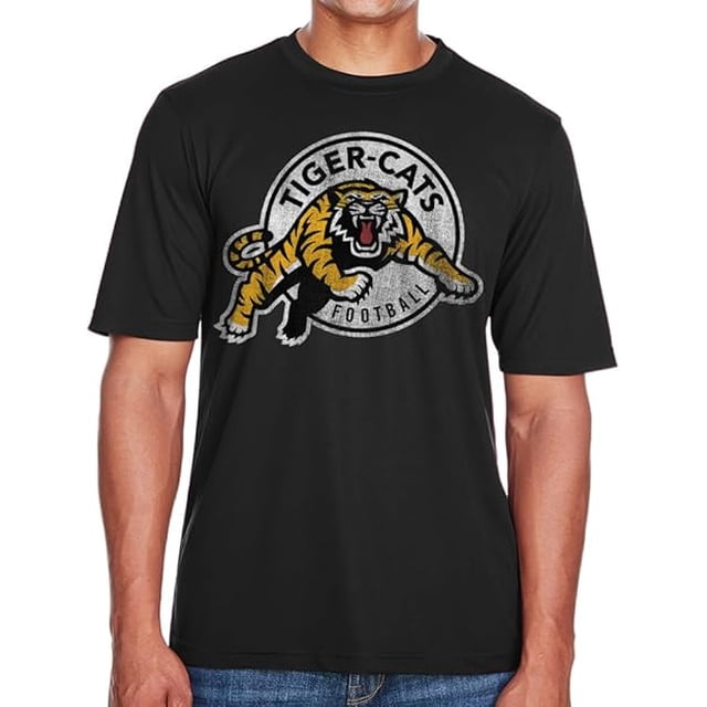 CFL Hamilton Tiger Cats Logo Black X-Large T-Shirt featuring a bold Tiger Cats logo on the chest. Made from high-quality cotton for comfort and durability, this gender-neutral fan apparel is ideal for supporters of the Hamilton Tiger Cats. The black colour complements the vibrant logo design.