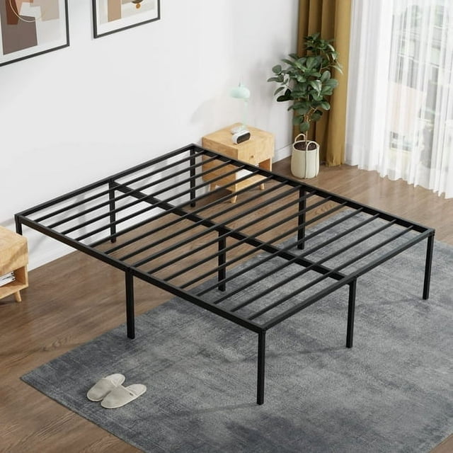 FDW Heavy Duty Metal Platform Bed Frame, Queen, 18'' Height, Noise-Free and Easy Assembly, No Box Spring Needed. A black steel bed frame with a modern minimalist design, featuring sturdy slats and six reinforced legs for stability. The frame offers 18 inches of under-bed clearance for storage and is designed to support all mattress types without requiring a box spring. Shown in a bright bedroom with wooden side tables, a potted plant, and a grey area rug.