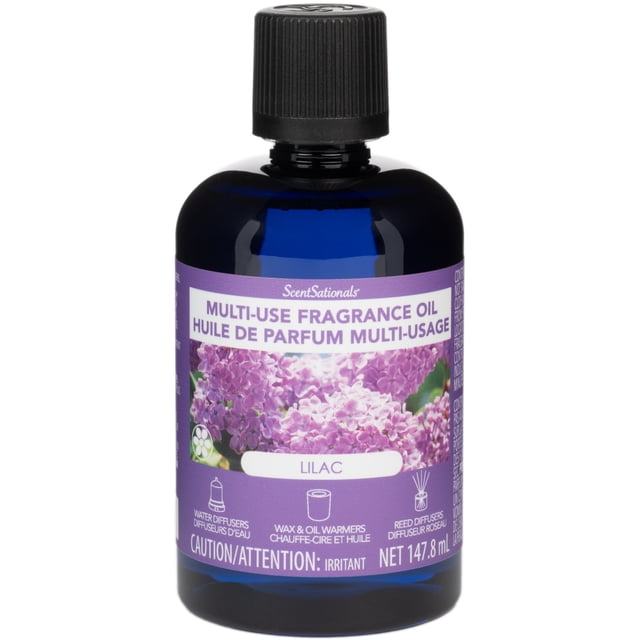 ScentSationals Huile Parfumée Multi-Usage Lilas dans une Bouteille Bleu Foncé avec Bouchon Nervuré Noir, Présentant une Étiquette Violette avec des Images de Fleur de Lilas et des Icônes pour Diffuseurs d'Eau, Réchauffeurs de Cire et d'Huile, et Diffuseurs à Anche, Contenant 147,8 ml pour un Parfum Personnalisable à la Maison Ou au Bureau.