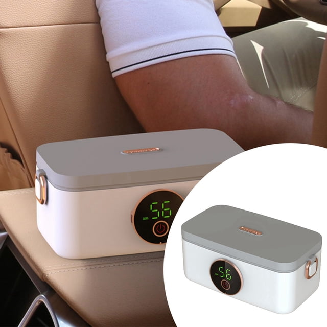 Cordless portable self-heating lunch box with rechargeable battery, featuring a grey lid, white base, and digital temperature display. Ideal for meal prep and on-the-go dining, shown positioned on a car seat for convenient travel use. Suitable for adult lunch storage and reheating.