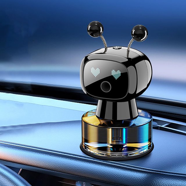 Meitianfacai Intelligent Robot Car Accessories Car Perfume, a 50ml car air freshener with a robot-shaped design featuring a glossy black finish, heart-shaped LED eyes, and a transparent base containing the fragrance. Positioned on a car dashboard, it adds a stylish and functional touch to the interior.