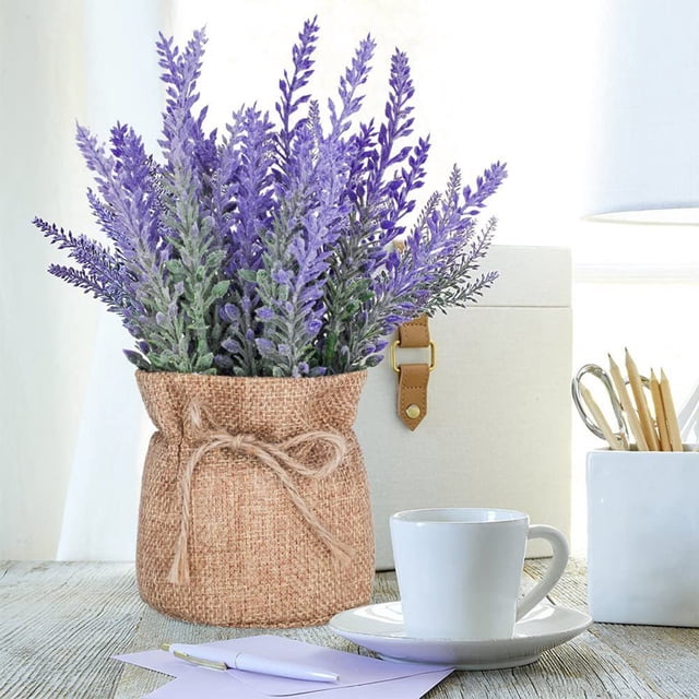 EGNMCR Home Decor artificial plant in pots with mini potted purple flowers in a cloth-wrapped pot tied with a bow. Perfect for fall decor, home, office, or event decoration, this simulation potted plant is displayed on a wooden table with a white coffee cup, stationery, and decorative items.
