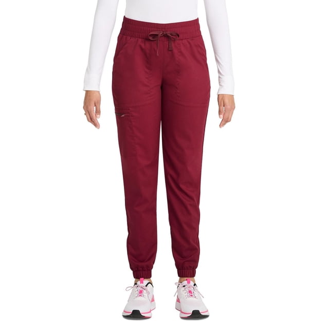 Scrubstar Pantalon d'Uniforme Cargo Jogger à Cordon pour Femmes Ultimate Stretch WC047A en Bourgogne, Vue avant Montrant une Coupe Jogger Fuselée avec Poignets Élastiques et Taille à Cordon Ajustable, Fabriqué en Tissu Extensible avec Cinq Poches Spacieuses, Dont une Poche Cargo Zippée, Assorti à des Espadrilles Blanches et un Haut à Manches Longues Blanc pour un Confort Toute la Journée.