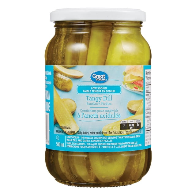 Great Value Tangy Dill Sandwich Pickles in a 500 mL clear glass jar with a white lid, showing crisp pickle slices in brine. The label highlights low sodium with 110 mg less sodium per serving than regular Great Value dill and garlic sandwich pickles, ideal as a condiment or snack, with bilingual English and French text.