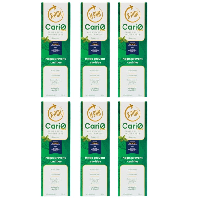 X-PUR CariØ Plus Tooth Paste 25% Xylitol & Citrox - Mint Flavor Fluoride Free Toothpaste Adult / Kids - 6 Pack. Six boxes of mint-flavored toothpaste are displayed in two rows, emphasizing features like fluoride-free, gluten-free, and eco-friendly formulation. Designed for oral care and tooth decay prevention, suitable for adults and children.