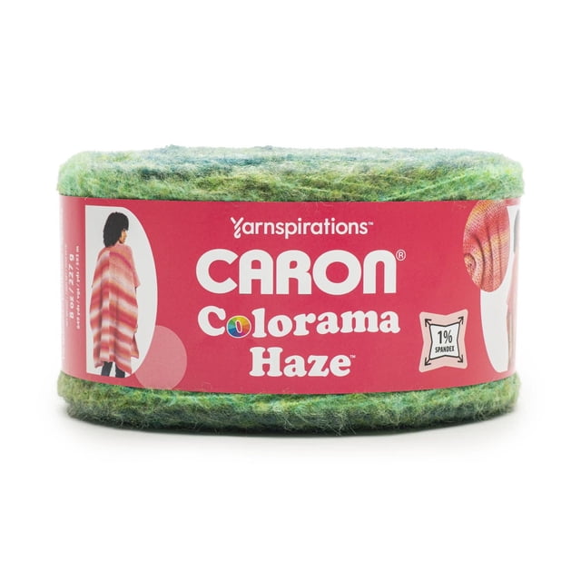 Caron® Colorama Haze™ Yarn, Fiber blend #4 Medium, 8oz/227g, 649 Yards, bulky weight acrylic striping yarn in variegated green tones with a soft, fuzzy texture, wrapped in a red label showing the brand and product name, suitable for knitting and crochet projects including cozy shawls and sweaters.