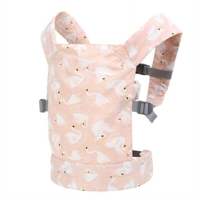 Doll Carrier For Kids Baby Doll Accessories Front And Back Carrier For Doll Original by GRM. This doll carrier features a soft pink fabric with a white swan pattern, adjustable grey straps, and a secure waistband. Suitable for children aged 3 to 8 years old, it allows for front and back carrying of baby dolls.