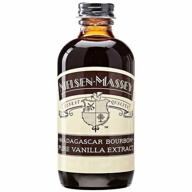 Vanilla Extract - 2 oz (60 mL) - Madagascar - Nielsen Massey clear glass bottle with black screw cap and Nielsen‑Massey label; single-source Madagascar vanilla from hand-selected beans, mellow, sweet, creamy flavour with a velvety aftertone, ideal for baking, desserts and pastry, often used to flavour custards and simple syrups.