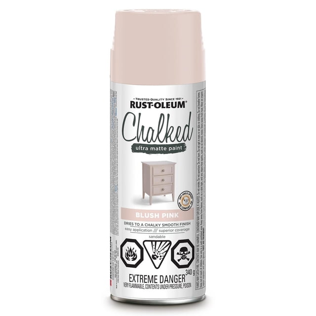 Rust-Oleum Specialty Chalked Ultra Matte Paint spray can in blush pink with label showing a small painted chest of drawers, highlighting ultra matte finish, easy application, superior coverage, and sandable properties for interior furniture and décor, with extreme danger warnings for flammability and poison.