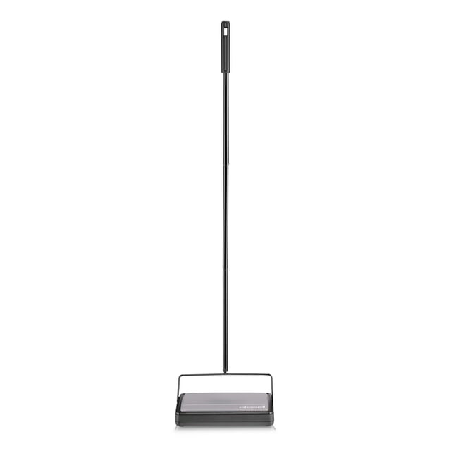 BISSELL Cordless Floor & Low Pile Carpet Sweeper in an open box condition. This lightweight, compact sweeper is powered by a rechargeable battery for cordless convenience and quiet operation. It features dual rotating brush rolls for effective cleaning of hard floors and low-pile carpets, and an easy-empty dirt container. The handle is upright and black, with the BISSELL logo visible on the base.