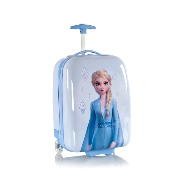 Heys Printed Kids 18" Luggage with a light blue hard shell featuring a printed character in a blue dress with braided hair. It has a push-button telescopic handle, inline skate wheels for smooth rolling on various terrains, and a fully lined interior with a zippered divider. Lightweight at 3.7 lbs, it is carry-on compliant and ideal for young travelers.