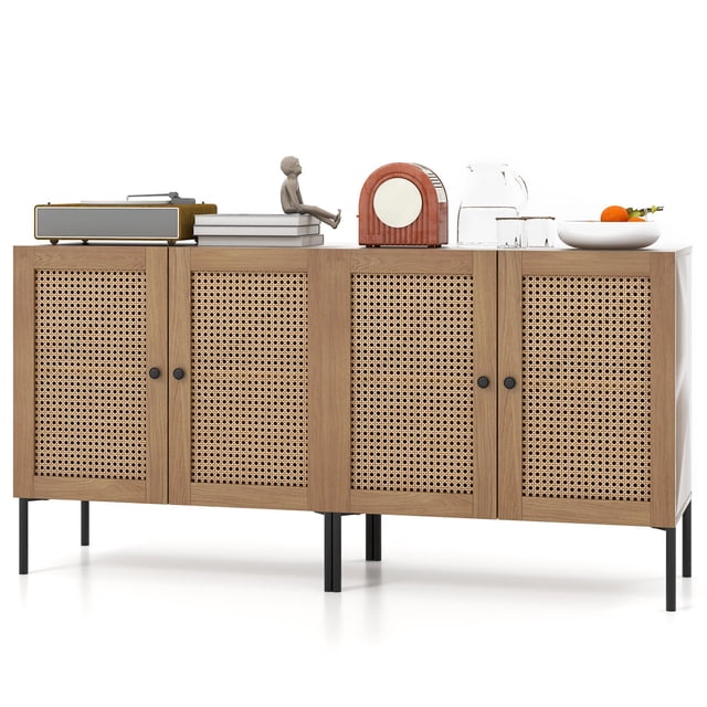 Giantex Sideboard Buffet Cabinet in oak finish with rattan-decorated doors and black metal legs. Features two spacious cabinets with adjustable shelves and round metal knobs. The cabinet top is styled with decor items, including books, a figurine, and a bowl of fruit. Suitable for kitchen, dining, or living spaces.