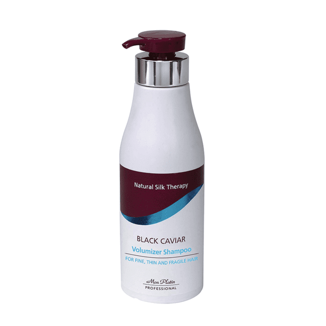 Mon Platin Volumizer Shampoo in a sleek white bottle with a maroon pump dispenser. The label highlights 'Natural Silk Therapy' and 'Black Caviar Volumizer Shampoo' for fine, thin, and fragile hair. Enriched with black caviar extract, Vitamin B3, and glycine amino acids, it nourishes and adds volume while preserving hair's luster and color.