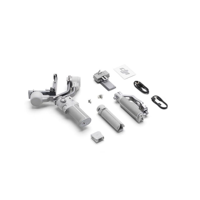 DJI RS 4 Mini Combo DSLR gimbal components arranged on a white background, showing the compact grey camera stabilizer with main handle, foldable arm, secondary handle, mounting plate, screws, USB cable, carabiner clip, and DJI accessory box, suitable for lightweight mirrorless cameras.