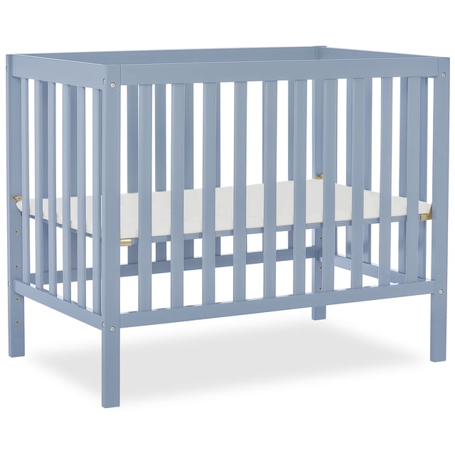 Dream On Me Edgewood 4-in-1 Convertible Mini Crib in blue with solid pine wood frame and vertical slats, featuring a 3-position adjustable mattress support system, suitable for nursery use and convertible to day bed and twin bed with rails sold separately.