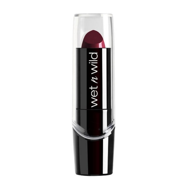 WNW Silk Finish Lipstick in a black tube with clear cap, showing deep berry color, featuring wet n wild branding, enriched with vitamins A and E, aloe vera, and macadamia nut oil for hydration and smooth lip care, ideal for a rich, silky lip color finish.