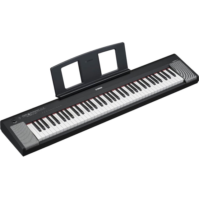 Yamaha Piaggero NP-35 76-Key Digital Piano with Adaptor, featuring a Graded Soft Touch keyboard for a natural piano feel with heavier bass keys and lighter high notes. The lightweight and portable design includes built-in speakers, a music stand, and compatibility with the Smart Pianist app for enhanced functionality. Ideal for practice, performances, and travel, it offers battery power with six AA batteries for up to five hours of playtime. Advanced Wave Memory Stereo Sampling ensures authentic sound quality.