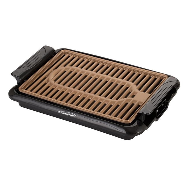 Brentwood Indoor Electric Copper Grill with a black base and removable copper non-stick grill plate featuring raised ridges, adjustable temperature control, and removable drip tray for healthier indoor grilling and easy cleaning.