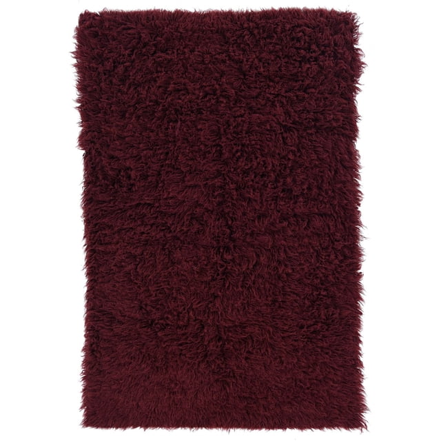New Flokati 1400gr 2'4" x 4'8" accent rug in burgundy, hand woven in Greece from 100% New Zealand wool with a deep plush shag pile, shown flat on white background, ideal for bedrooms or bathrooms and often used as a cozy decorative accent in small spaces.