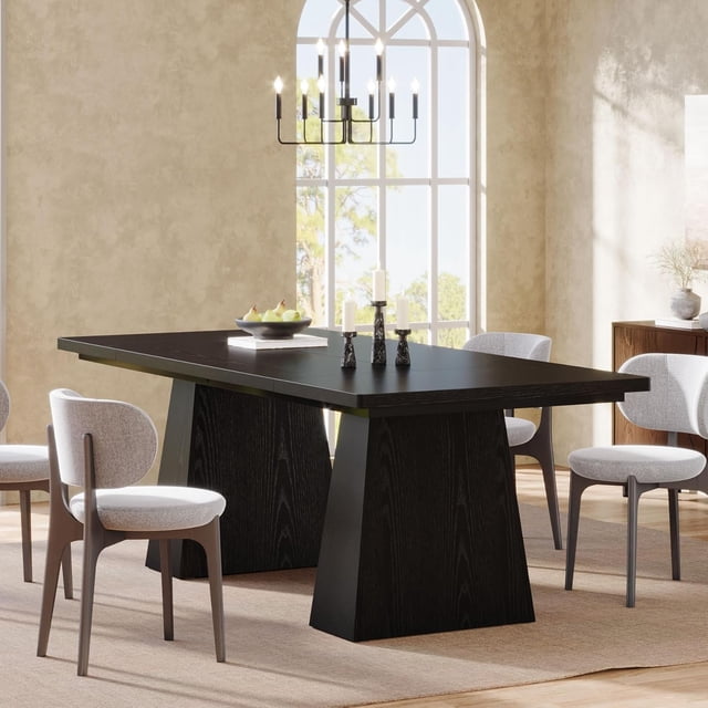 Tribesigns Dining Table for 6, a farmhouse-style rectangular kitchen table with a smooth black wood finish and double pedestal base. Measuring 63 inches long, 31.1 inches wide, and 29.5 inches high, it comfortably seats six people. Ideal for dining rooms or as a workspace for creative projects, shown in a bright, modern dining room setting with chairs and decor.