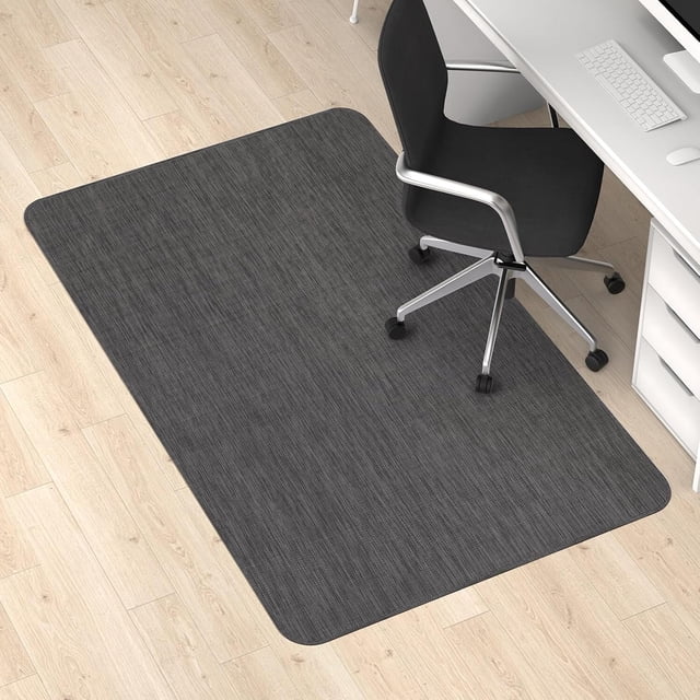 Home Office Chair Mat for Hardwood Tile Floor, 36" x 48" PVC Carpet Protector Computer Gaming Chair Mat with Non-slip Rubber, Black. The mat features a rattan-like woven pattern, a non-slip rubber backing, and a waterproof, stain-resistant surface. Designed to protect hardwood, laminate, and tile floors from scratches and damage, it is compatible with wood, vinyl, and concrete floors. Shown in a home office setting under a black office chair on a light wood floor.