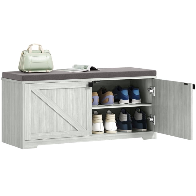 HOMCOM Shoe Bench with Storage in light grey, featuring a cushioned top in a breathable linen-feel fabric and a farmhouse-style design. The bench includes four storage compartments with adjustable and removable shelves, accommodating up to 8 pairs of shoes, including larger sizes up to CA 12. Made of particleboard with a melamine-faced surface for easy cleaning, it supports up to 353 lbs. (160 kg). Suitable for use as an entryway bench or hallway organizer.